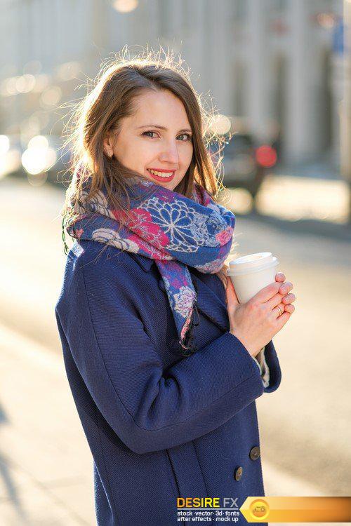 Young woman on the street with a cup of coffee in hand 12X JPEG