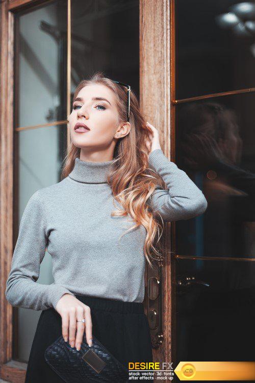 Fashionably dressed blonde is walking around the city 11X JPEG