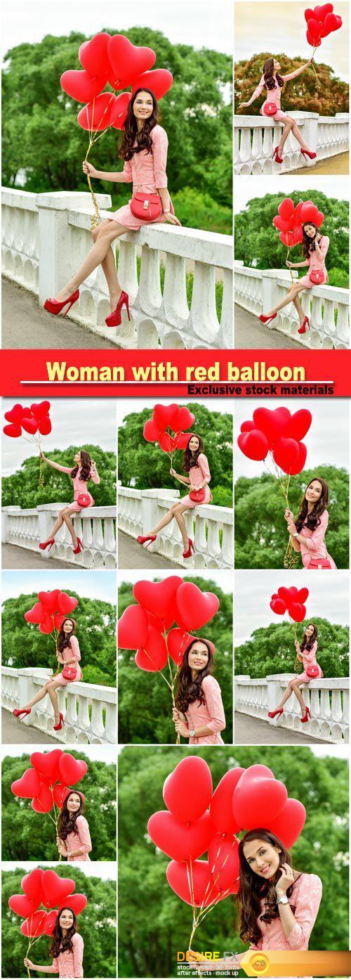 Woman with red heart balloon, beautiful girl with bunch of hearts outdoors