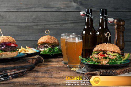 Variety burgers with light beer on a wooden table 9X JPEG