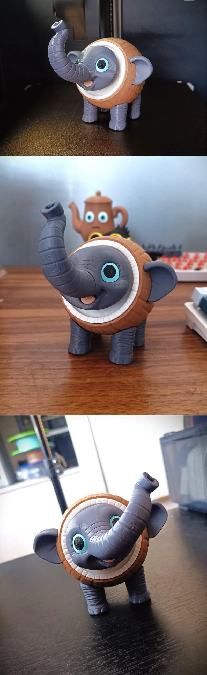 Articulated 3D printed toy elephant named Cocofanto Elefanto, with a grey body, brown segmented armor, and large blue...