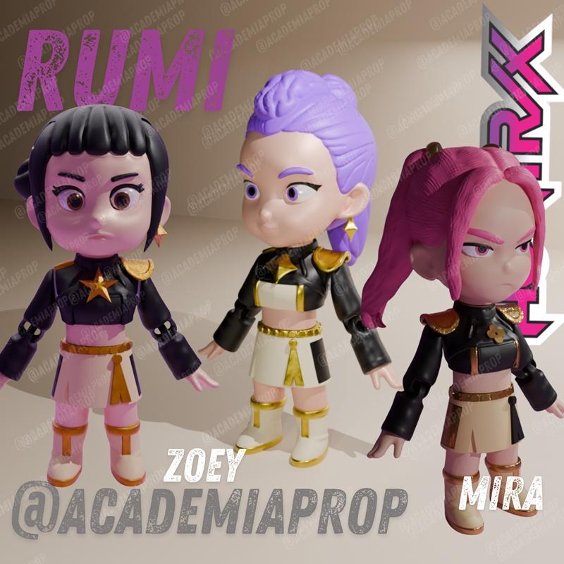 Three chibi-style 3D printed figures named Rumi, Zoey, and Mira, wearing matching black and gold outfits. Rumi has bl...