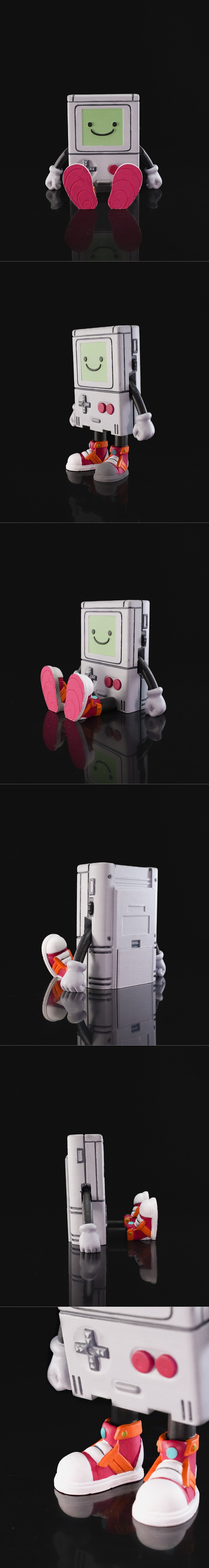 Articulated BMO figure from Adventure Time, seated with a smiling green screen, white gloves, and pink shoes. Studio...