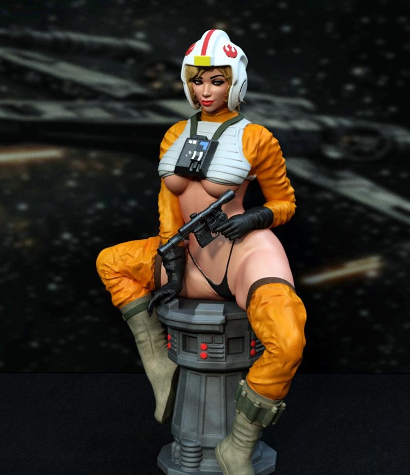 Star Wars Rebel pilot pinup figure seated on a cylindrical base, wearing an orange flight suit, white cropped top, he...