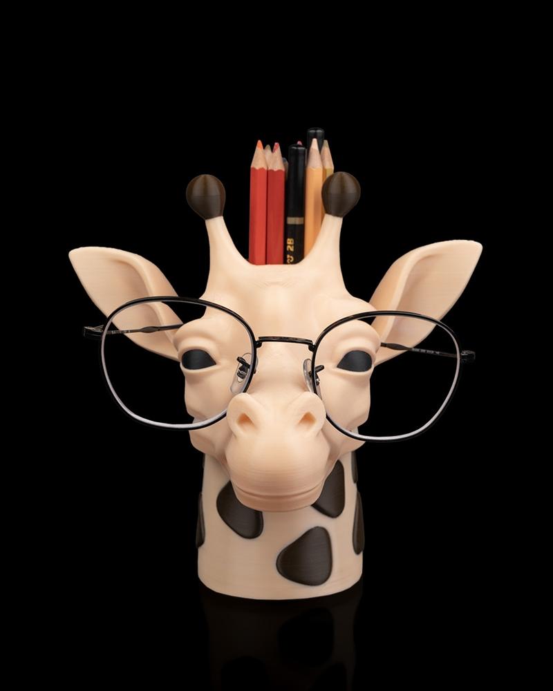 3D printable model of a giraffe head wearing round glasses, functioning as a pen and pencil holder. The giraffe has b...