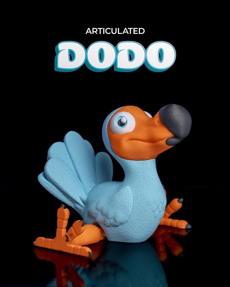 Articulated dodo figure with orange beak and feet, blue body and wings, posed on a reflective surface against a black...