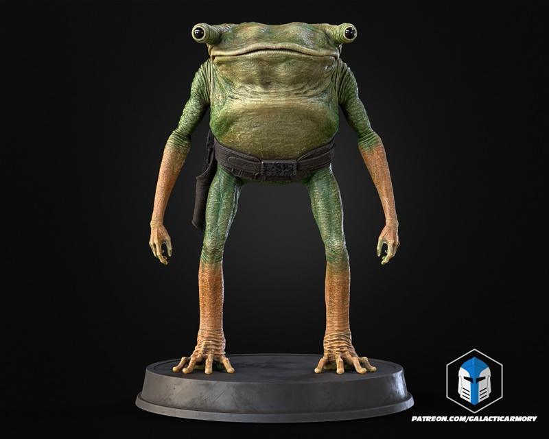 Turgle character figure from Star Wars, standing on a dark circular base. The alien has green and orange skin, large...