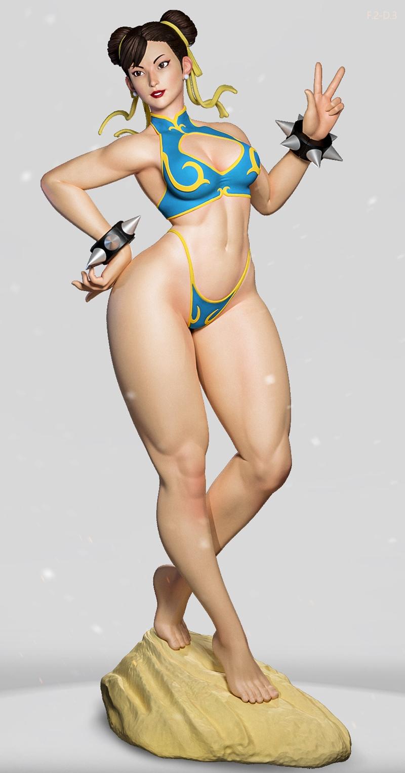 Chun-Li figure in blue and yellow bikini, wearing spiked bracelets, striking a victory pose on a rock base.