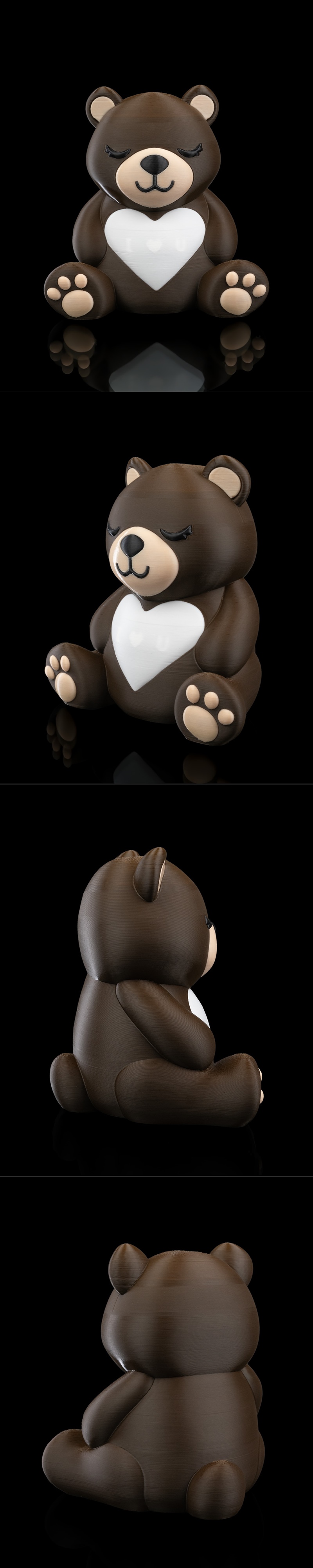A 3D printed bear holding a glowing yellow heart with "I ♥ U" inscribed on it. The bear has closed eyes and...