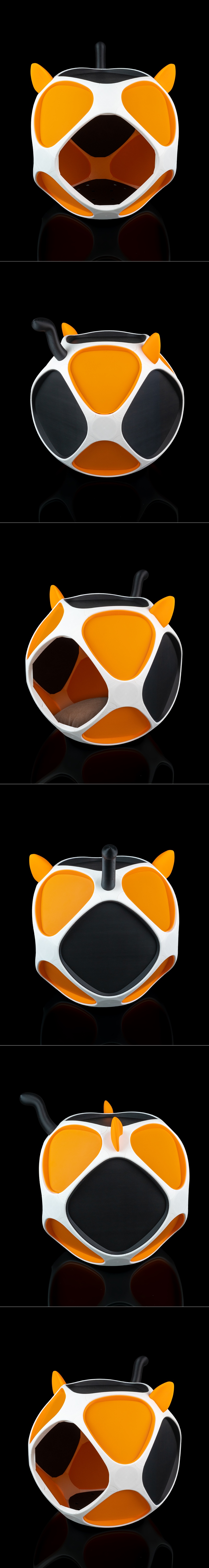 Geometric Meow Pet House with cat ears, featuring white, orange, and black panels, and a brown cushion inside, on a b...