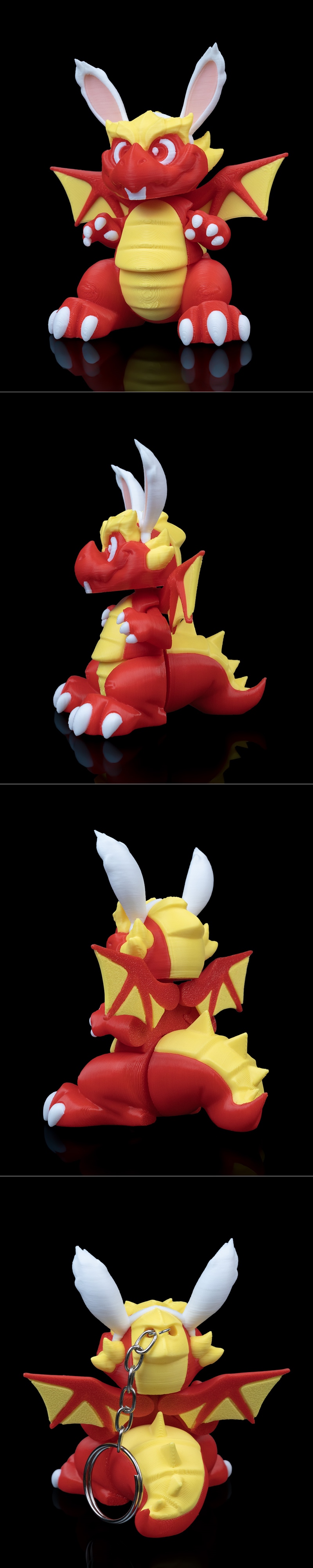 Red and yellow 3D printed figure of a dragon with white bunny ears, sitting with wings spread.