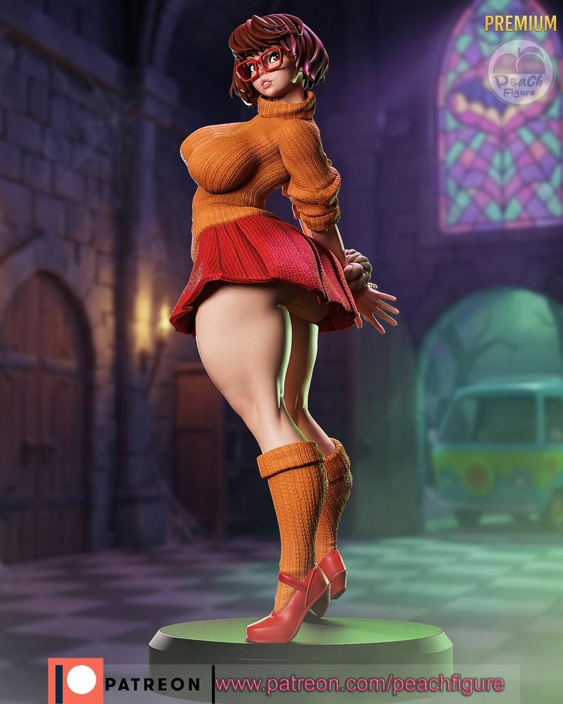 Velma Dinkley figure in orange sweater and red skirt, wearing thigh-high socks and red heels, posed suggestively on a...