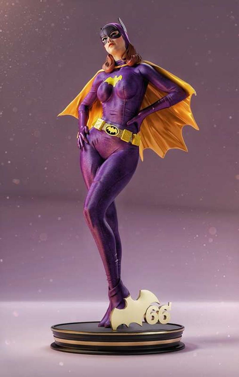 Batgirl figure in purple suit and yellow cape, standing heroically on a base with a Bat-Signal and '66' emblem. Model...