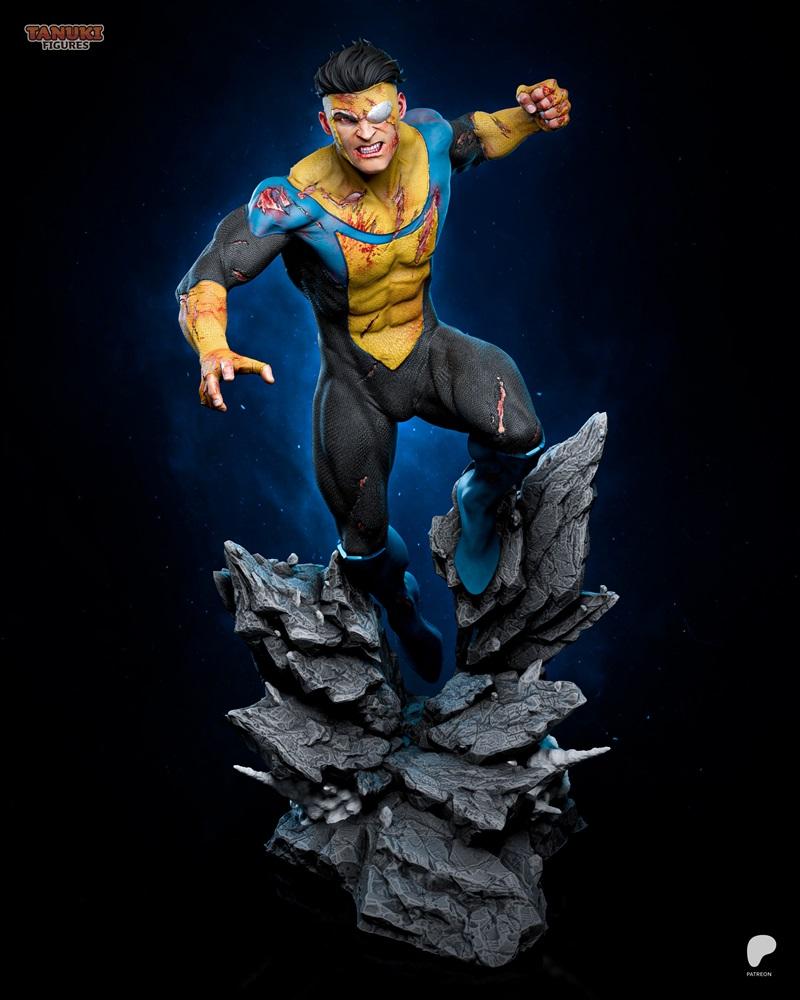 Mark Grayson, also known as Invincible, in a dynamic pose atop jagged rocks. He wears a damaged blue and yellow suit...