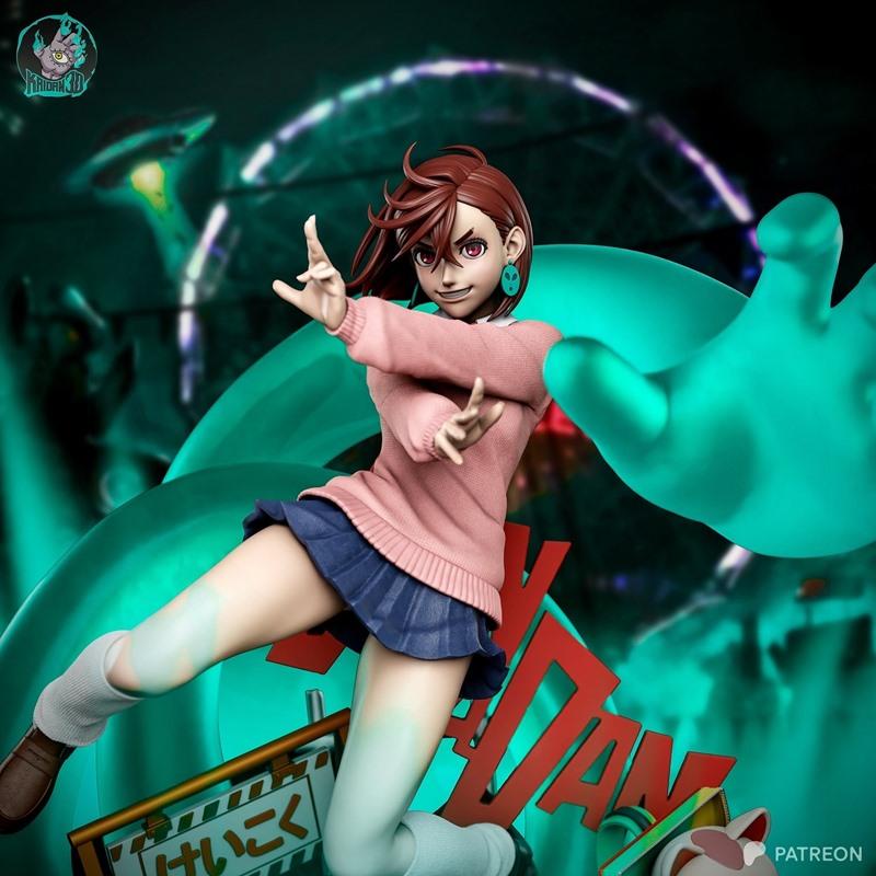 Momo Ayase 3D model figure in pink sweater and blue skirt, striking an action pose with hands raised, anime style, de...