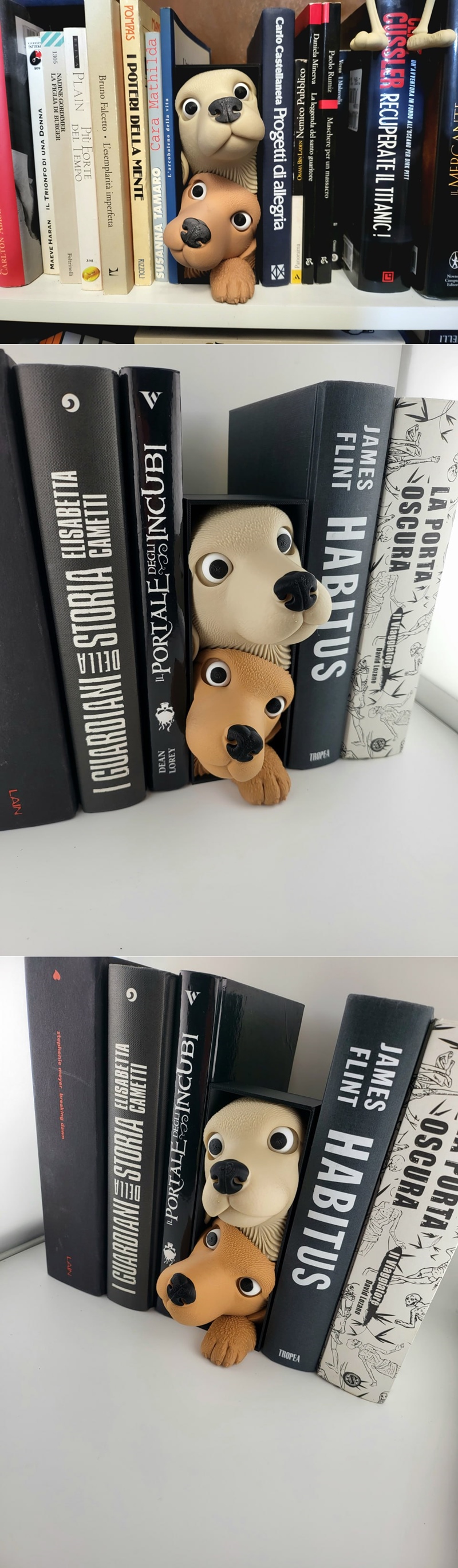Two cute dog faces with large eyes and black noses peek out from between books on a shelf. One dog is light tan, the...