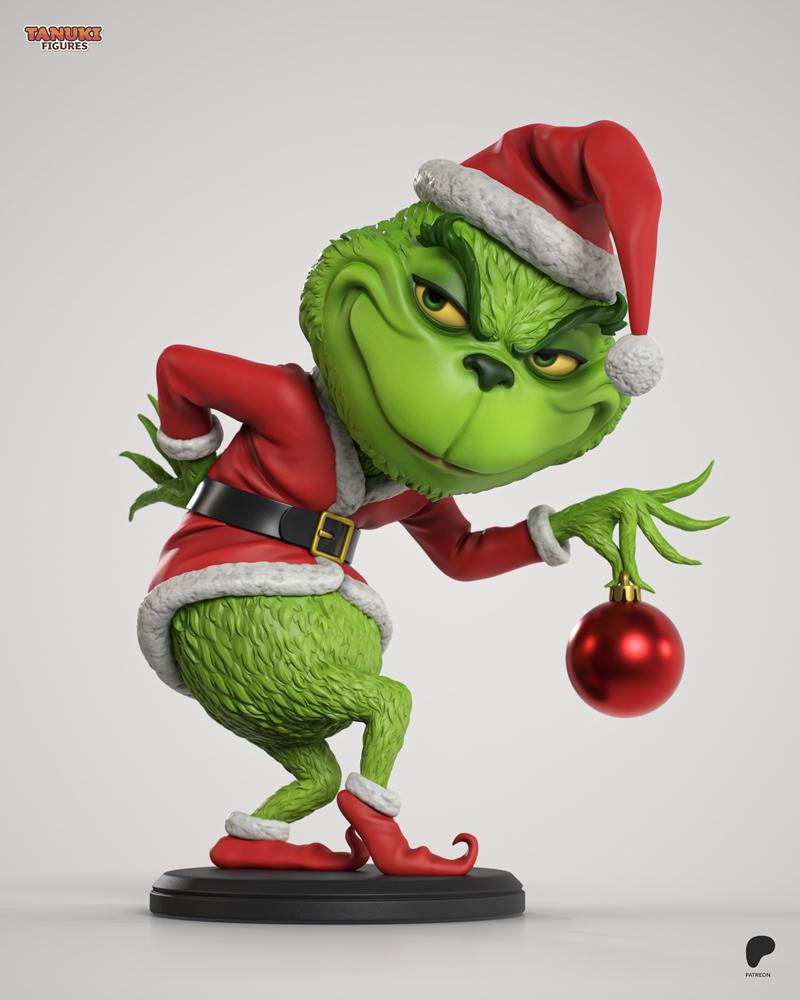 Chibi Grinch figure in Santa outfit holding a red Christmas ornament, posed mischievously on a black base. Tanuki Fig...