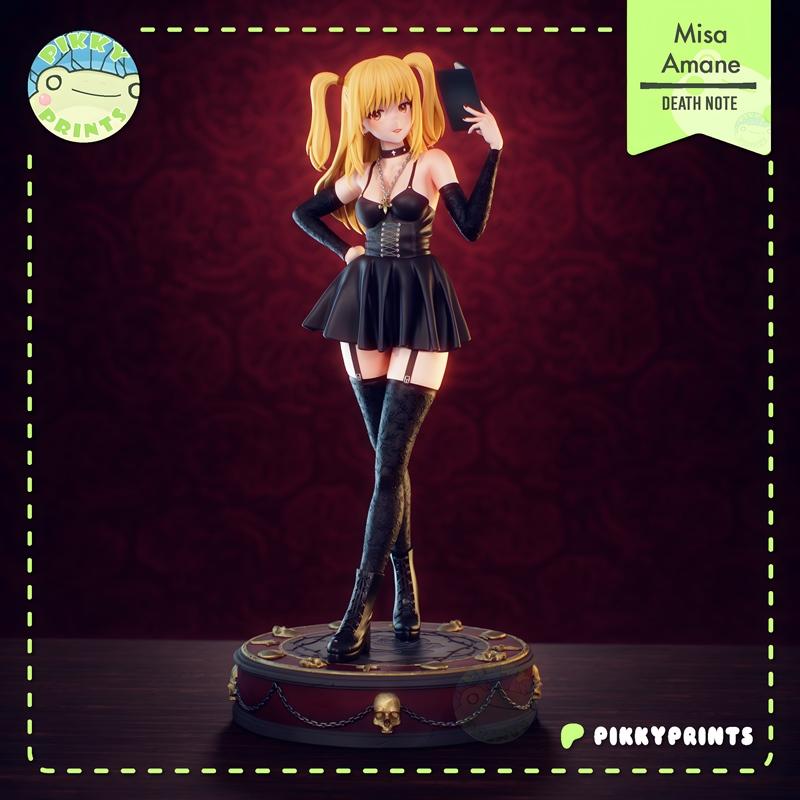 Amane Misa 3D model figure from Death Note, wearing a black gothic outfit with thigh-highs and holding a book, posed...