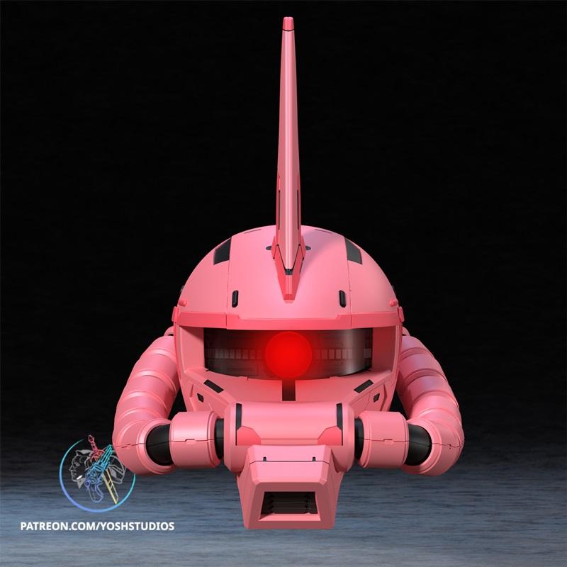 Pink Zaku II helmet from Gundam, featuring a red mono-eye, forehead horn, and detailed mechanical components. Model b...