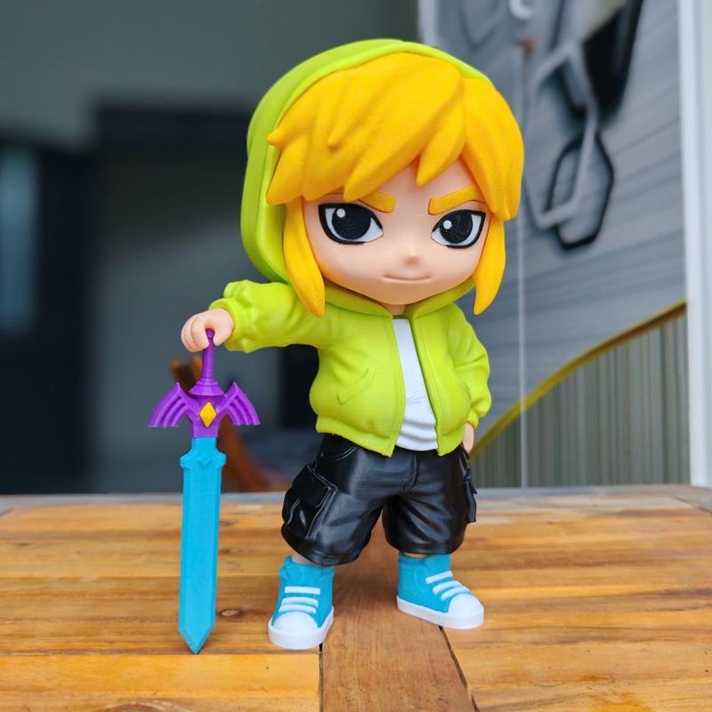 Chibi Link figure in urban attire, wearing a green hoodie, black shorts, and blue sneakers, holding the Master Sword.