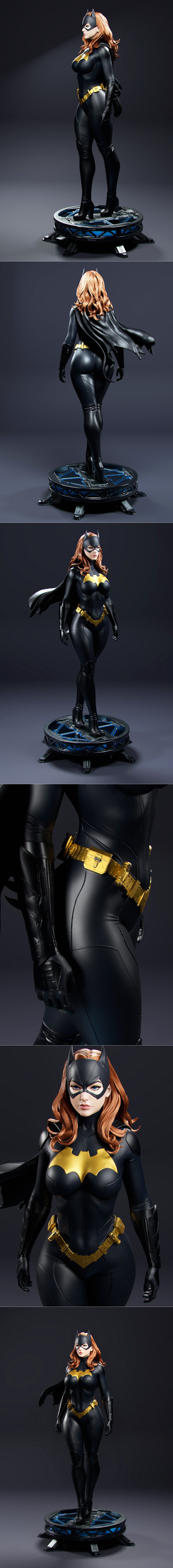 Batgirl in black and gold suit with cowl and cape, standing heroically. Detailed 3D model by Abe3D.