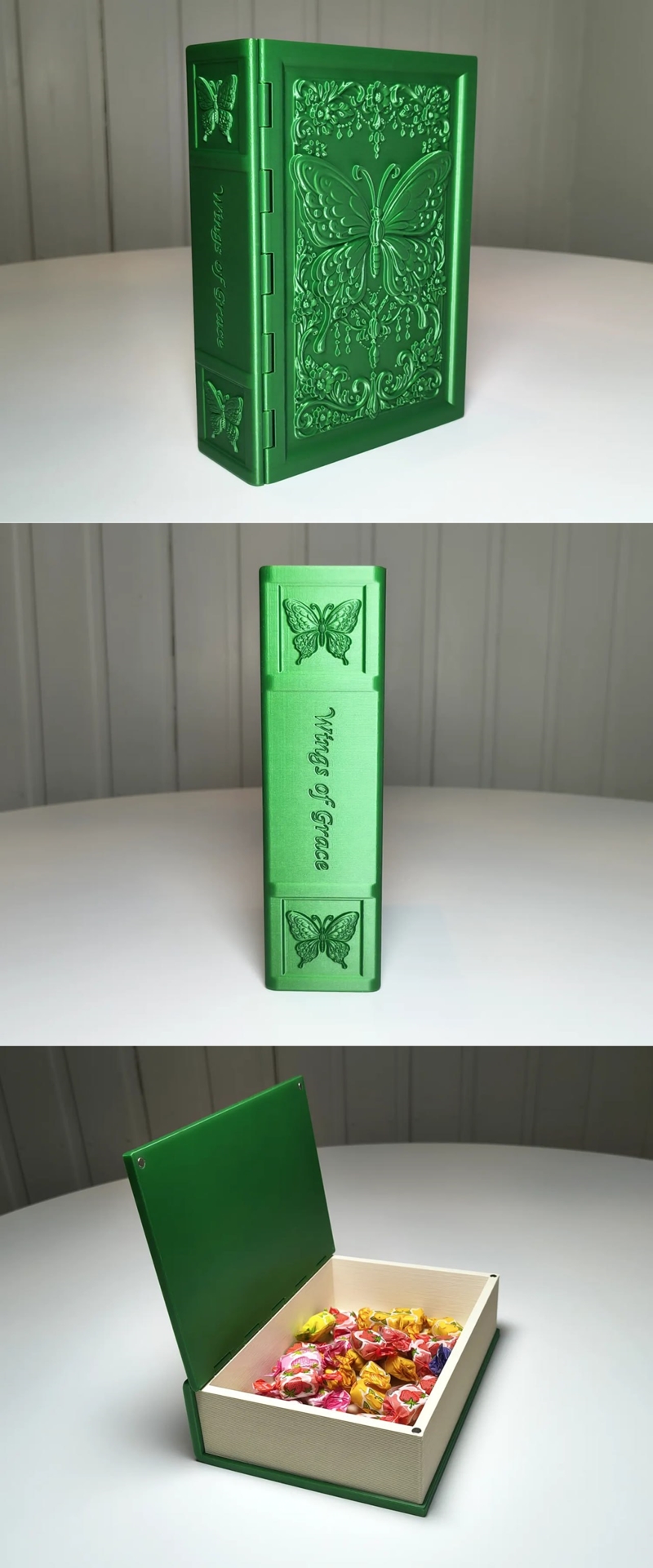 Green 3D printed secret storage book with ornate butterfly and floral carvings on the cover, featuring a hinged lid.