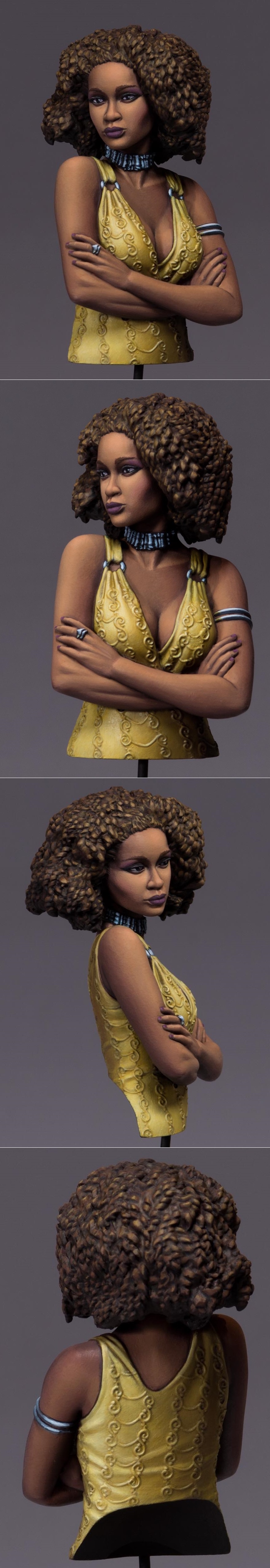 Bust of a woman with a large, curly brown afro hairstyle, wearing a yellow, patterned halter top and a dark, textured...