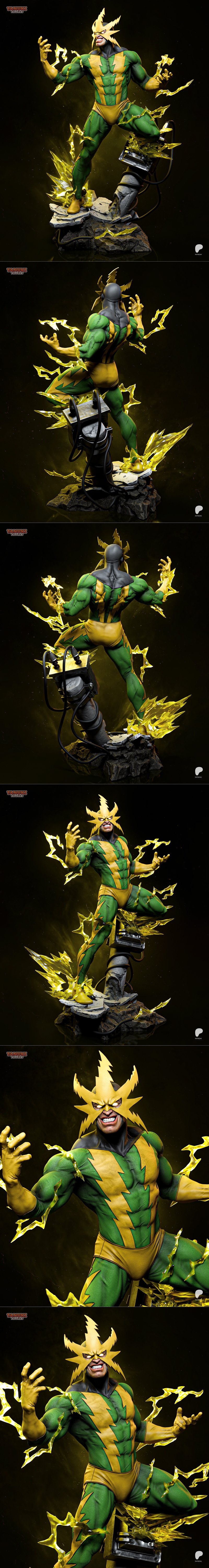 Electro figure in green and yellow suit, crackling with yellow lightning, on a rocky base. Tanuki Figures studio.