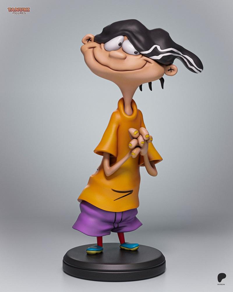 3D model figure of Edd from Ed, Edd n Eddy, wearing an orange shirt and purple shorts, standing on a black base with...