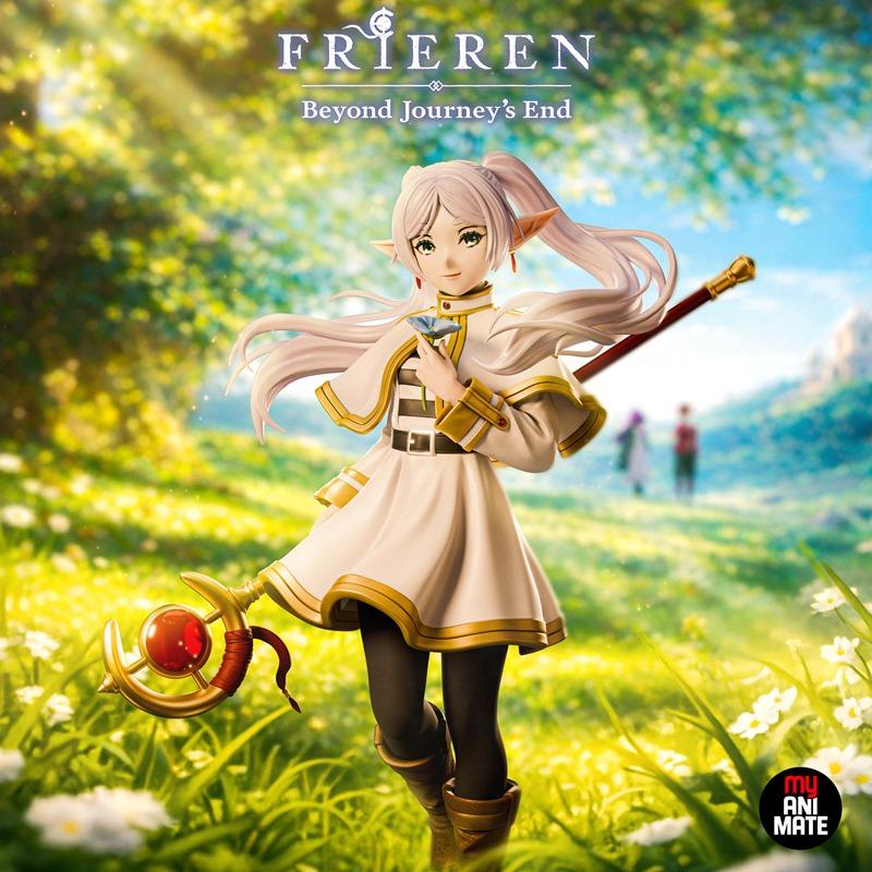 Frieren anime figure by MyAnimate, standing in a sunny meadow holding a flower and a staff. She wears a white and gol...