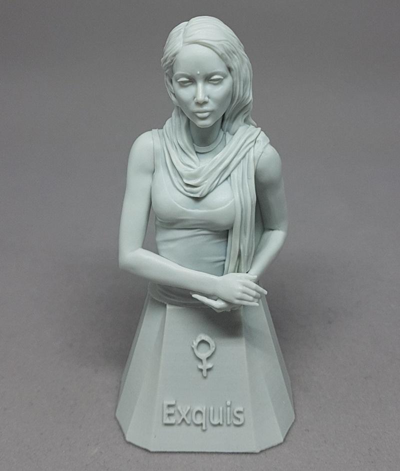 3D printable bust of a serene woman named Saanvi, wearing a scarf and simple dress, hands clasped, with 'Exquis' insc...