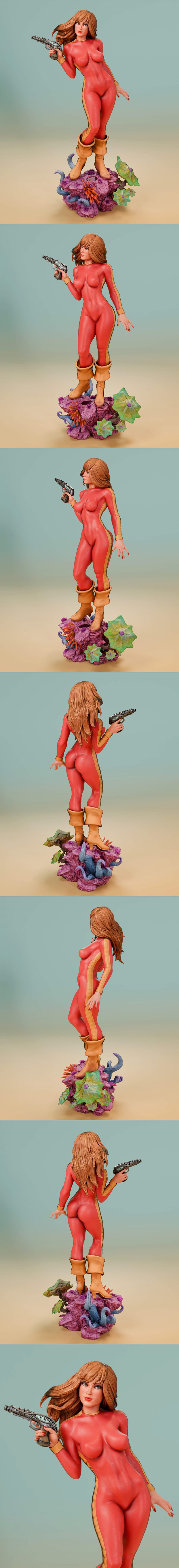Barbarella figure in a red and yellow sci-fi suit holding a blaster, standing on an alien landscape base with tentacl...