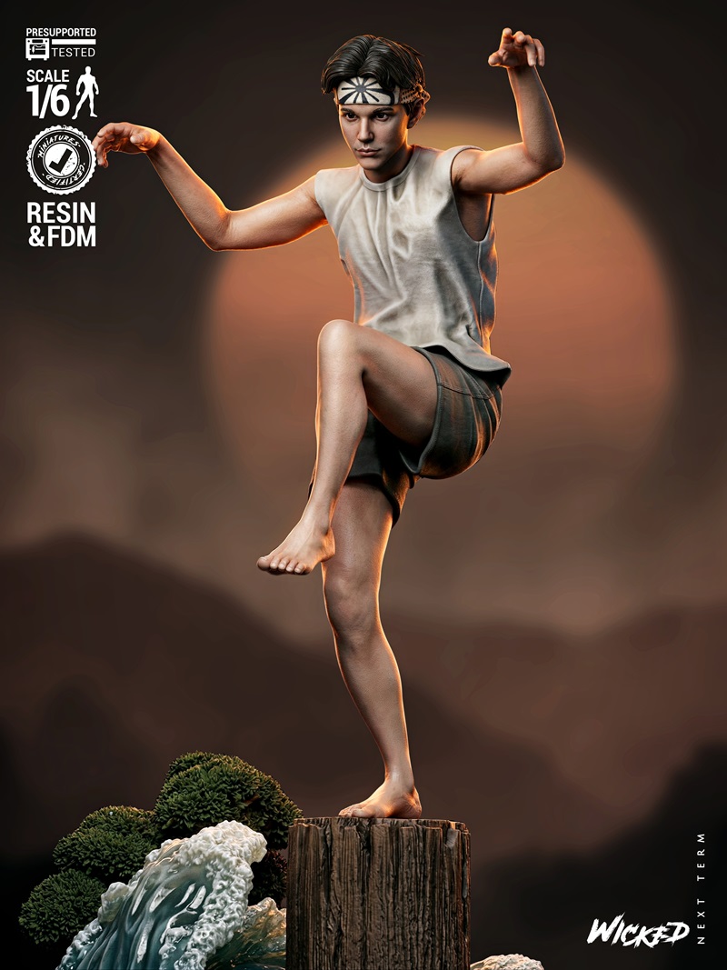 1/6 scale 3D printable figure of Daniel LaRusso from The Karate Kid, balancing on a wooden stump with waves and foliage.
