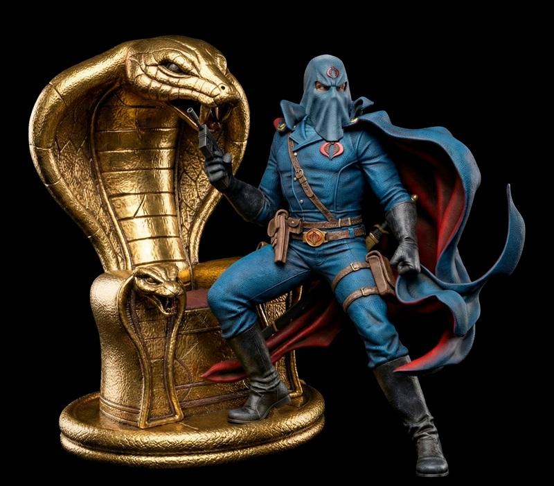Cobra Commander figure in blue uniform and red-lined cape, holding a pistol, seated on a large golden cobra throne. B...