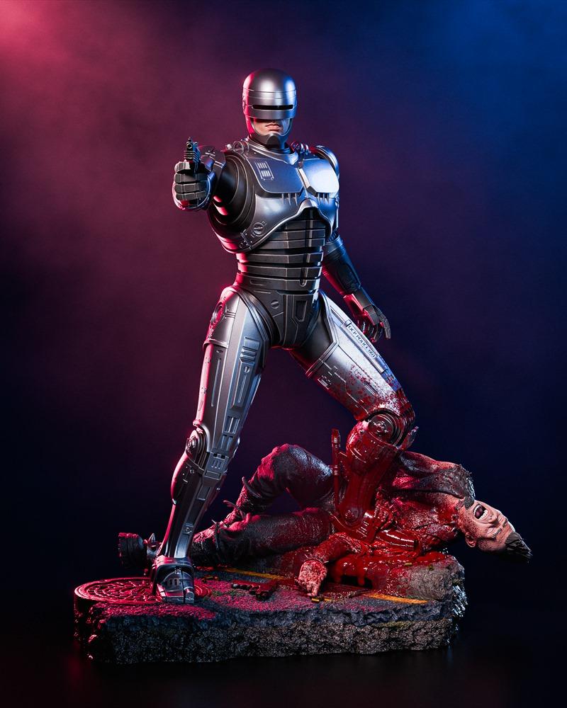 Robocop figure standing over a bloody corpse, holding a pistol. Detailed metallic armor, gore on the base. Dramatic r...