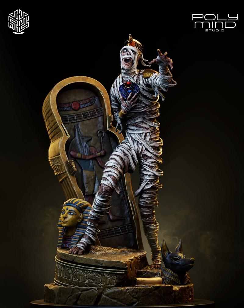 PolyMind Studio Mummy figure on a diorama base with sarcophagus, pharaoh bust, and Anubis statue. The mummy is wrappe...