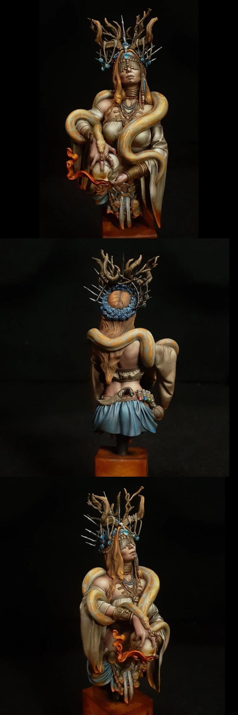 Two 3D printed busts: a male barbarian with an axe and skulls, and a female sorceress with snakes and elaborate headd...