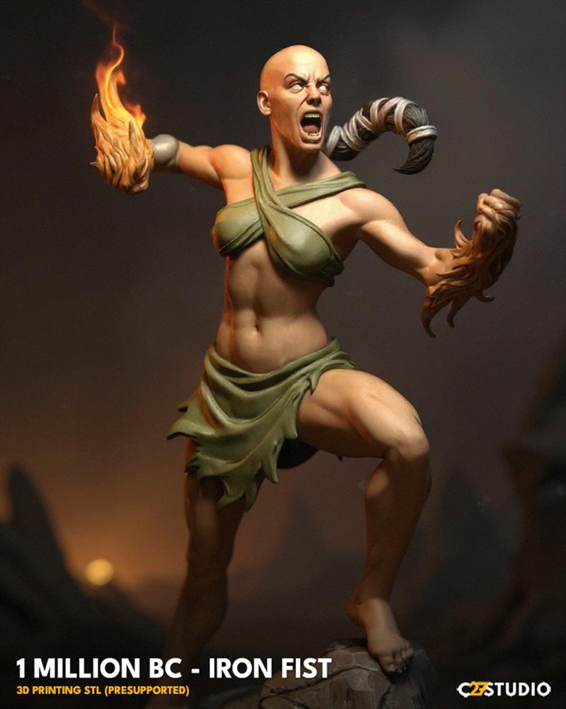Bald female warrior, Million BC Iron Fist, in a combat pose with one hand wreathed in flames. She wears a green, prim...