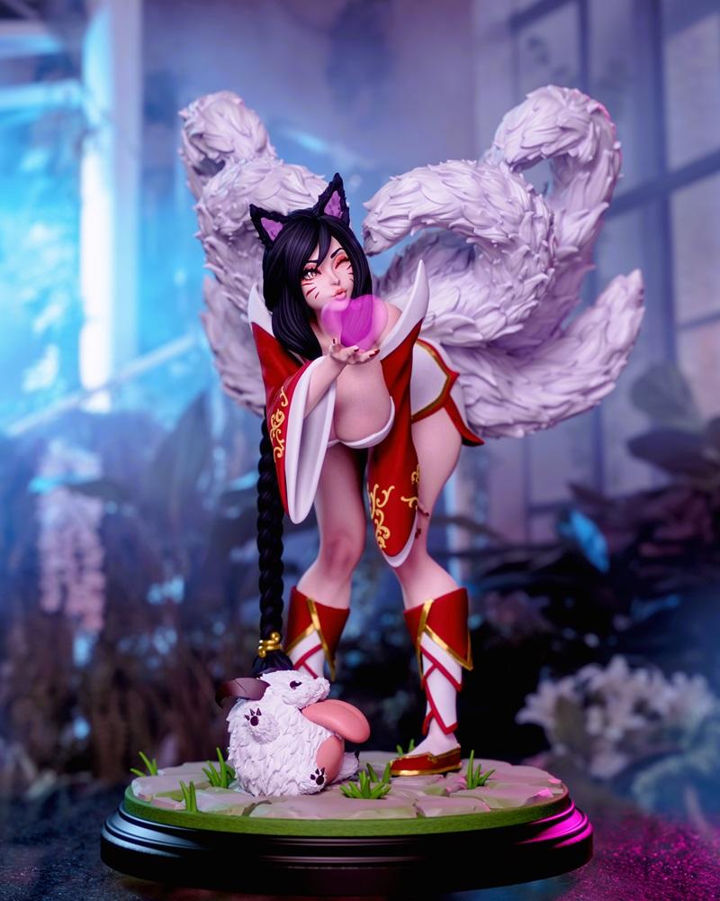 Ahri from League of Legends figure, nine-tailed fox girl in red outfit holding pink orb, with a Poro at her feet, Mom...