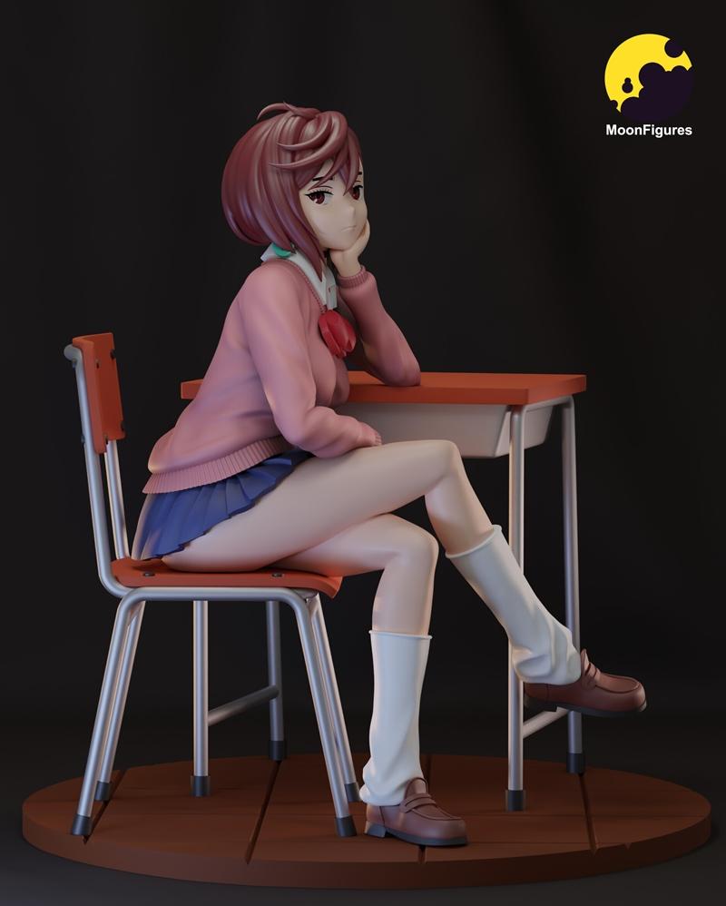 3D model of Momo Ayase in a school uniform, sitting at a desk with her head resting on her hand.