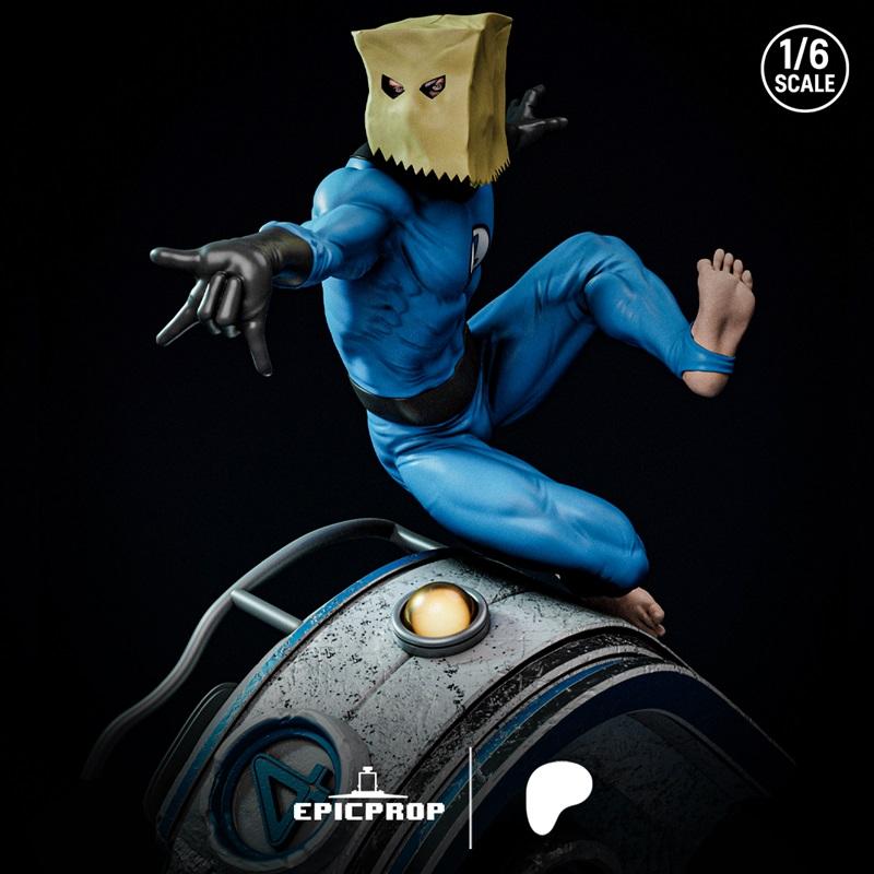 1:6 scale 3D model of Bag-Man in a blue suit and paper bag mask, striking a dynamic pose on a detailed base.