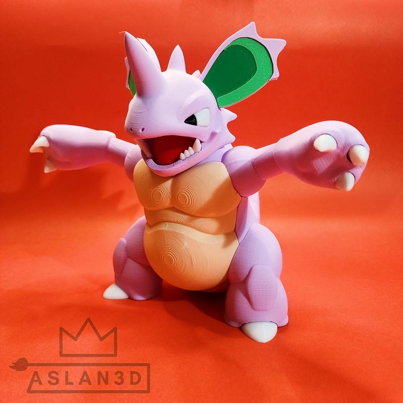 3D printed figure of Nidoking, a purple bipedal monster with green-eared frills, open mouth, sharp teeth, and extende...