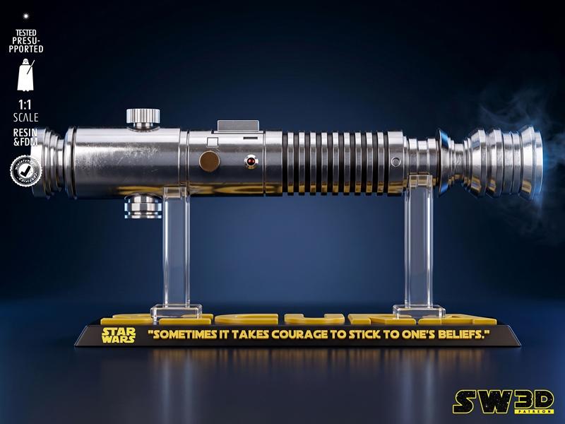 1:1 scale replica of Aayla Secura's lightsaber from Star Wars, displayed on a stand with "Star Wars" logo a...