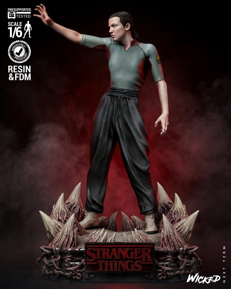 1:6 scale 3D model figure of Eleven from Stranger Things, standing heroically on a base with Upside Down elements. Sh...